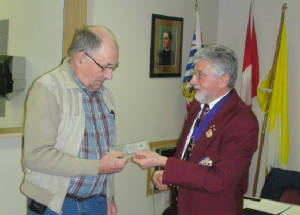 KOFC4949; Sir Knight Ralph Hounslow receives his Life Membership from Grand Knight Guenter A. Rieger