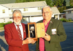 Grand Knight Guenter A. Rieger presenting the Silver Rose to Grand Knight Ingo Schollerman, 